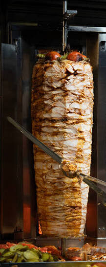 Shawarma meat roasting on a vertical spit