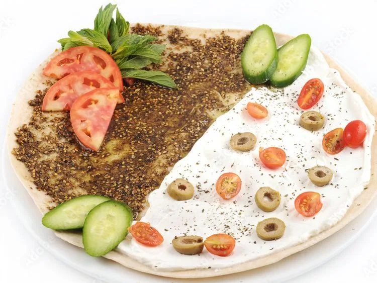 Flatbread topped with zaatar and labneh