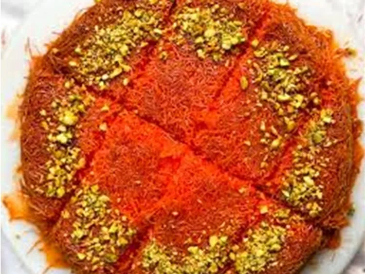 Kunefe with golden shredded pastry and pistachios