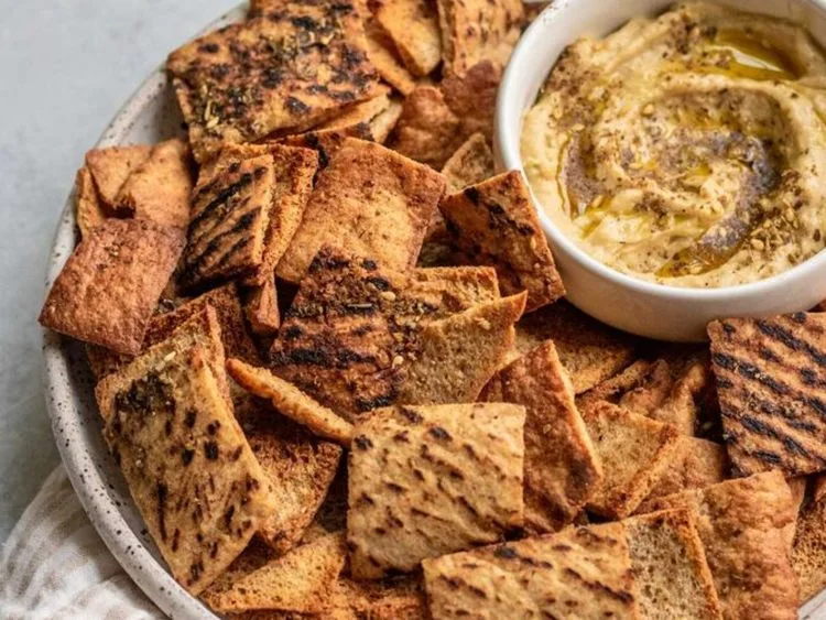 Crisp pita chips served with dip