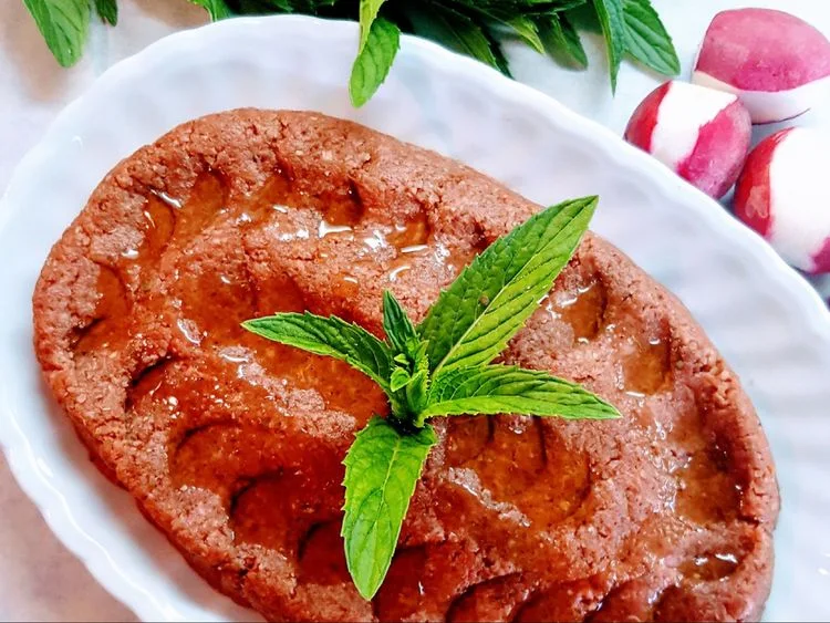Kibbeh nayeh garnished with herbs