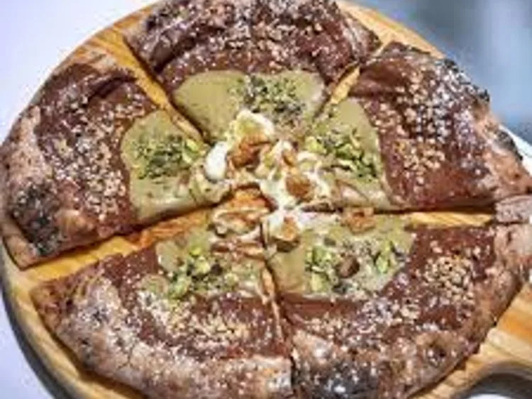 Chocolate and pistachio-topped sweet pie