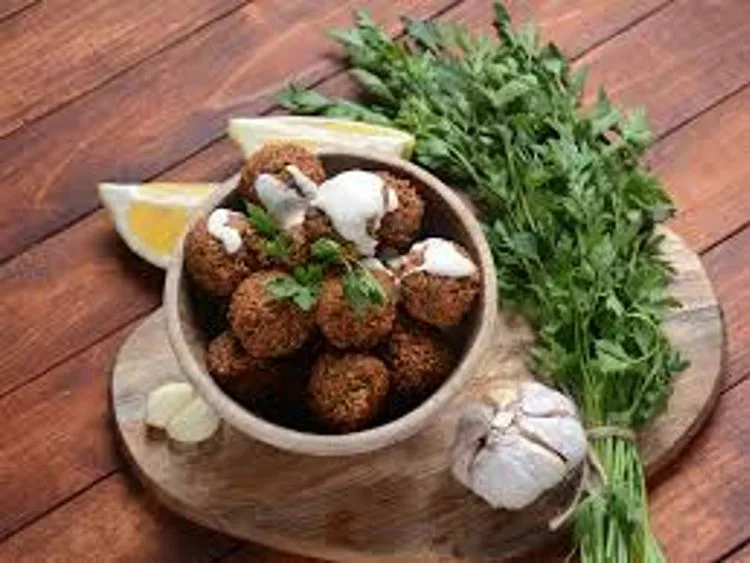 Falafel served with vegetables and tahini