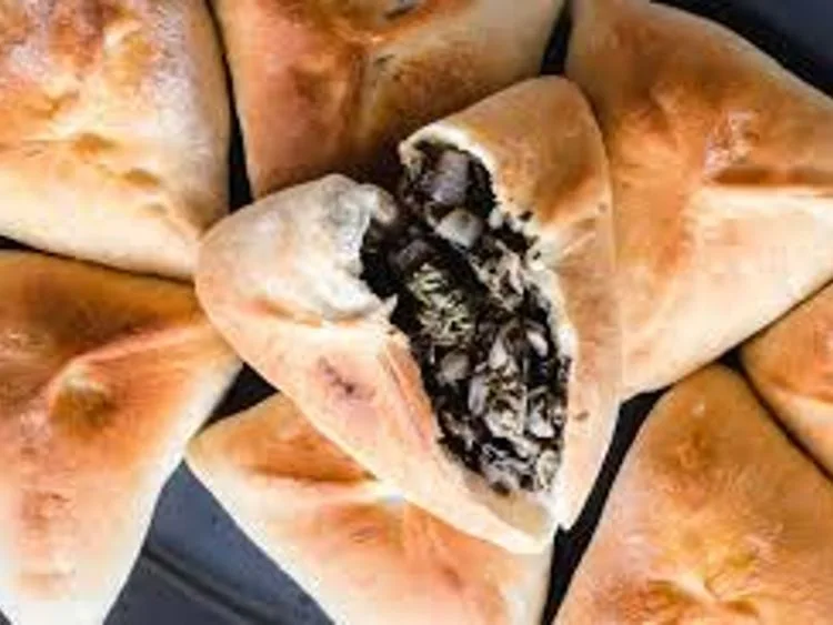 Triangular spinach-filled pastries