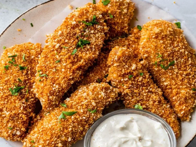 Breaded chicken tenders served with dip