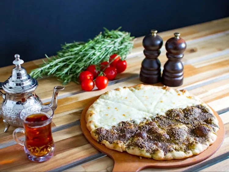 Flatbread topped with zaatar and cheese