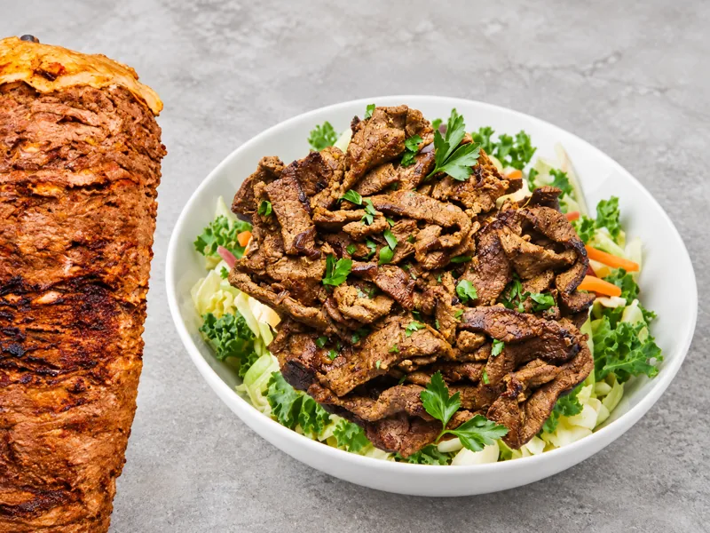 Beef shawarma over salad