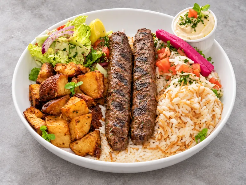 Kafta bowl with rice, potatoes and salad