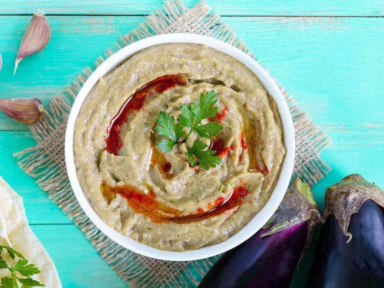 Baba ghanouj garnished with olive oil and spices
