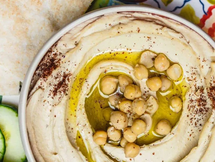 Hummus topped with chickpeas and olive oil