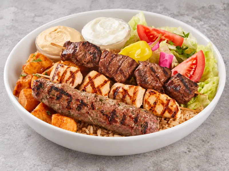 Mixed skewer bowl with rice, vegetables and dips
