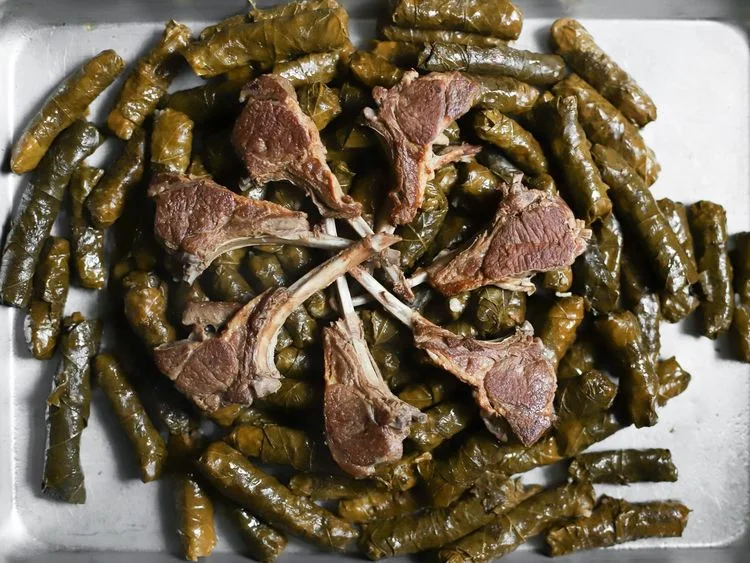 Stuffed grape leaves served with meat