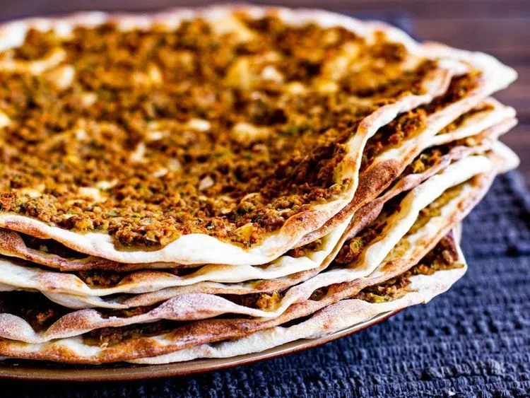 Stacked lahmajeen meat flatbreads